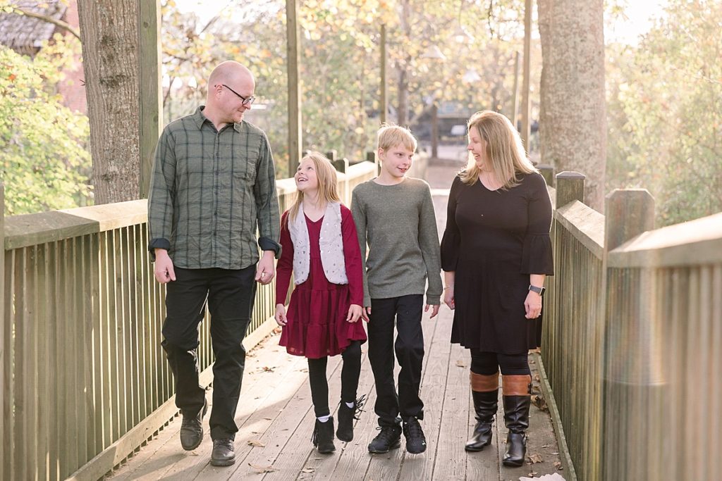 Family walks through Heritage Park for fall family portraits