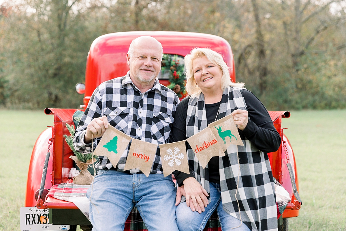 Families pose with Vintage Red Truck for Christmas Portraits