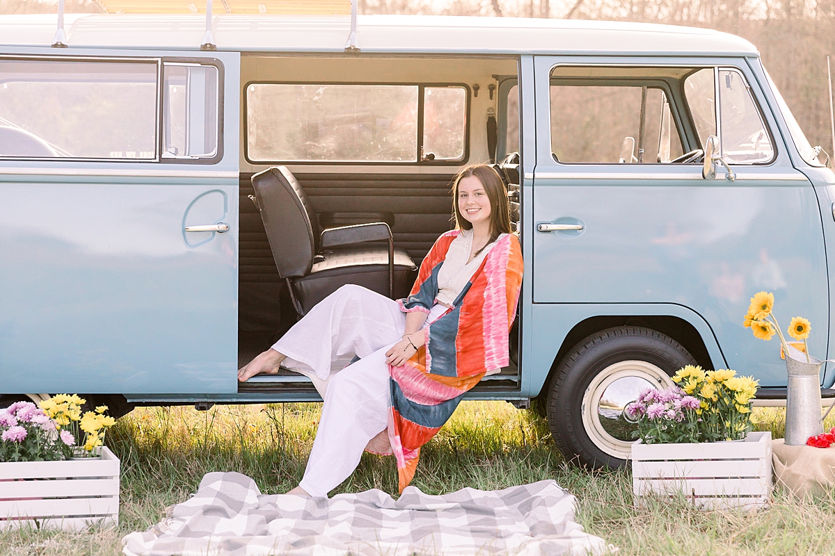 Teen sits in blue VW bus for sweet 16 portraits