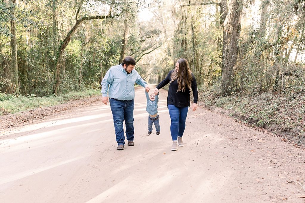 Family has fun on dirt road in Lake Park for family session